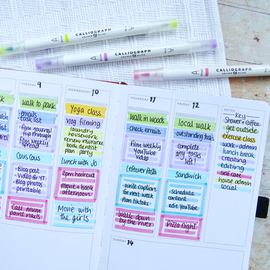 Photo of Planner with colour coded tasks and pens