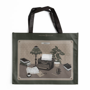 Olive green tote bag illustrated with vintage typewriter and writer's desk scene