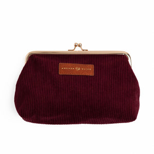 Maroon corduroy kiss-lock pouch with rose-gold frame and leather brand patch