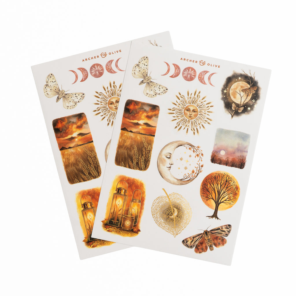 Two sticker sheets with sun, moon, lantern, and autumn tree illustrations