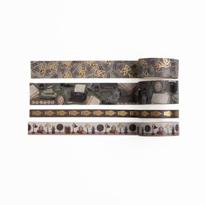 Four rolls of The Writer's Desk Washi Tape with typewriter, lamp, and gold geometric patterns