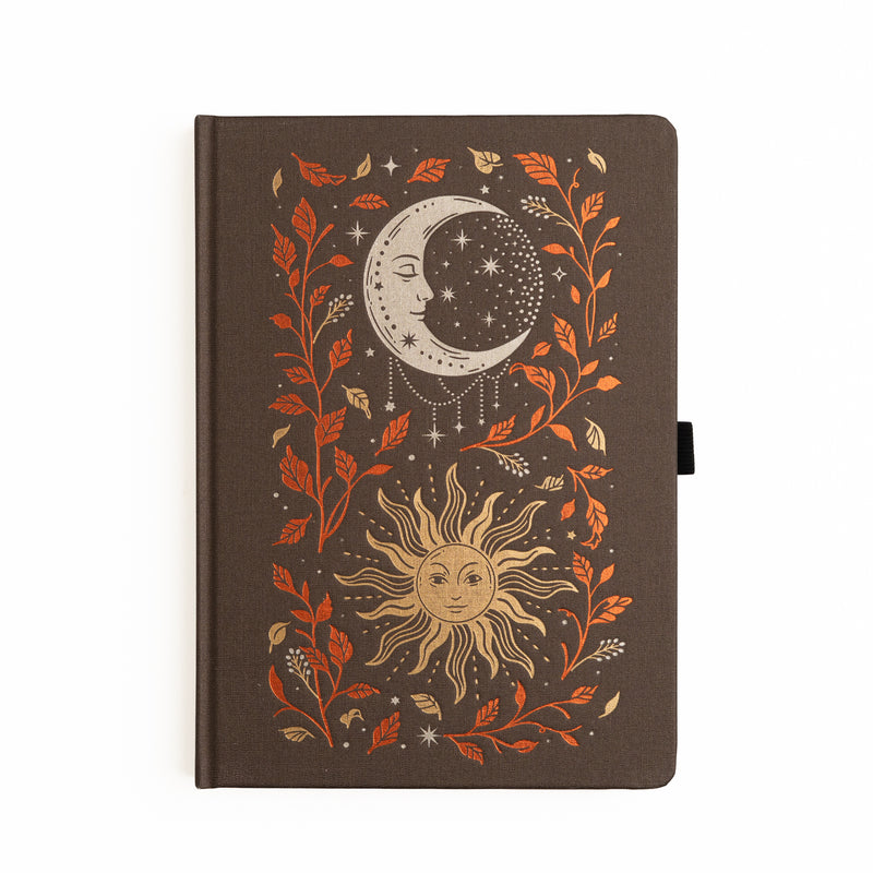  Dark buckram notebook with foiled celestial sun and moon design surrounded by autumn leaves