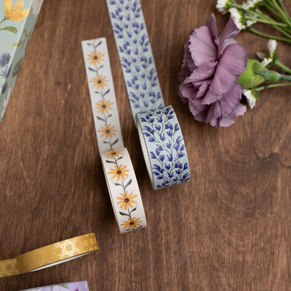 Two rolls of decorative tape with floral patterns 