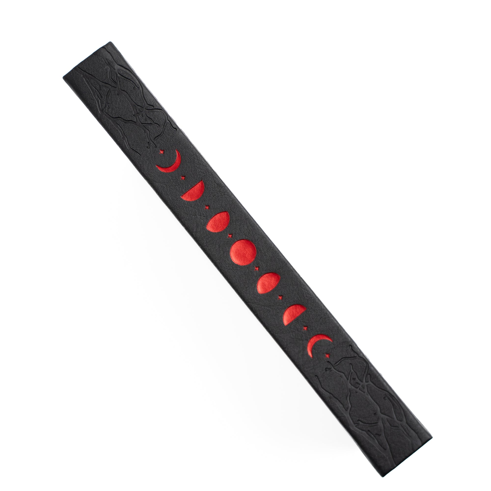 Black Notebook spine with red moon phases on a white background