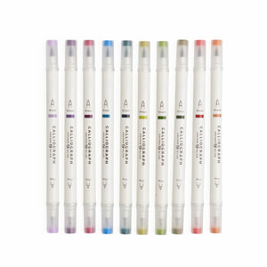 Set of Calligraphic markers with colored caps on a white background