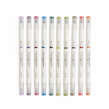 Set of Calligraphic markers with colored caps on a white background