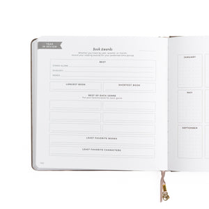 Open planner with book awards section on a white background