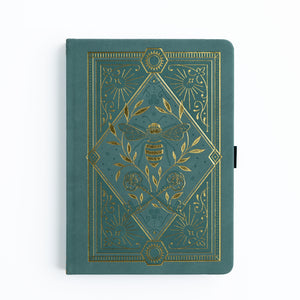 Green notebook with gold embossed design featuring a bee on a white background