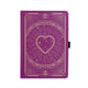 Purple notebook with gold heart design on a white background