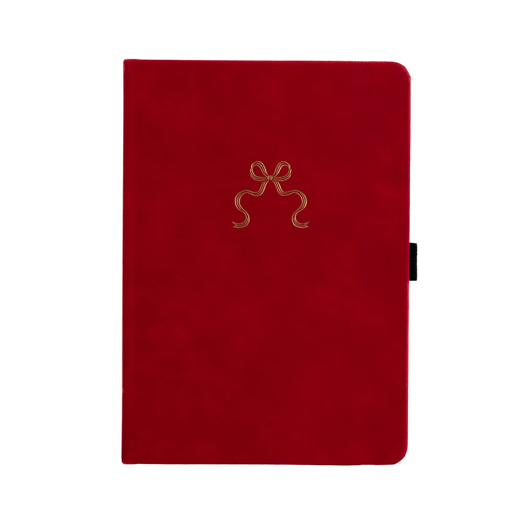 Red notebook with a gold bow design on a white background