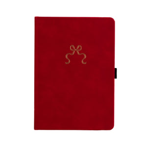 Red notebook with a gold bow design on a white background