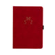 Red notebook with a gold bow design on a white background