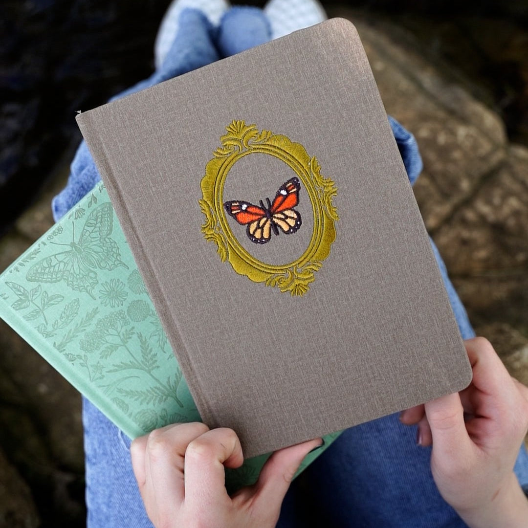 Brown notebook with butterfly design