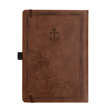 Brown leather notebook with wave and anchor design on a white background